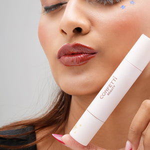 Lip Gloss and Tint model holding tease me trio Brew Naaz shade